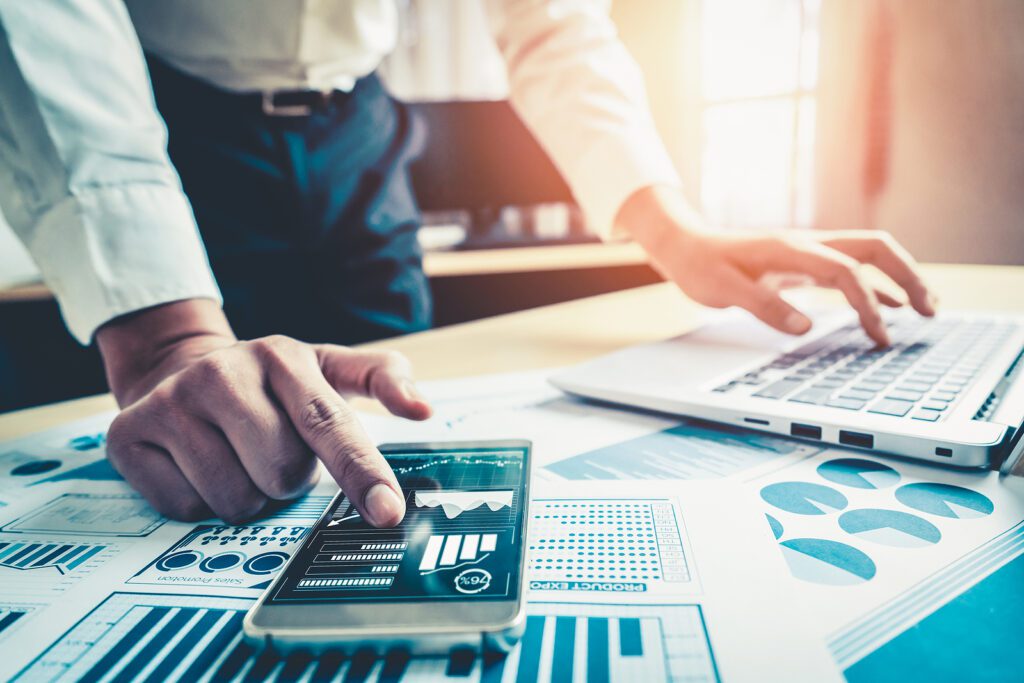 Businessman accountant or financial expert analyze business report graph and finance chart at corporate office.